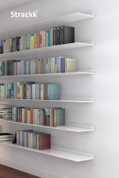 a white book shelf filled with lots of books