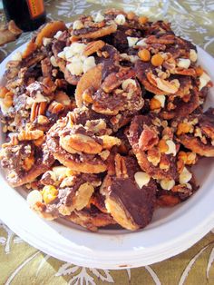 a white plate topped with nuts and raisins