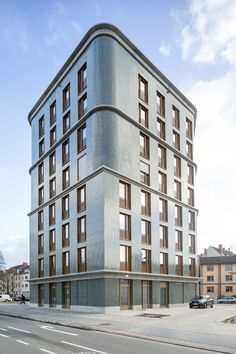 an architectural rendering of a building on the corner of a street