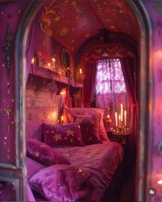 a bed with purple sheets and pillows in a room that looks like a princess's bedroom