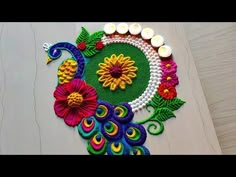 a colorful rang art work with candles and flowers