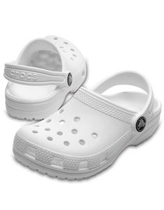 Crocs Classic Clogs. Easy on, easy off! Just like the adult Classic, the kids' version offers amazing comfort and support, thanks to the light, durable Croslite™ material and molded design. Kids can customize their Crocs clog however they like; ventilation holes accommodate Jibbitz™ brand charms. Pivoting heel straps for a more secure fit. Easy to clean. Iconic Crocs Comfort™: Lightweight. Flexible. 360-degree comfort. Imported. White Clogs, White Crocs, Rubber Clogs, Crocs Clog, Dr Shoes, Crocs Clogs, Crocs Classic Clogs, Classic Kids, School Shoes