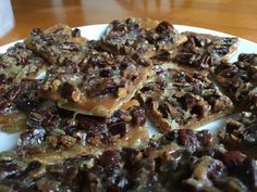 several pieces of pecan bar on a white plate