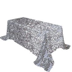 a silver sequin tablecloth on a white background