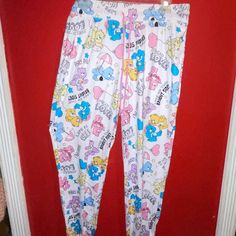 New W/O Price Tag Is An Overstock Outlet (Has Black Line Going Thru Cloth Label Name To Prevent Store Return) Authentic Care Bears Pants - Sleep/Lounge Pants - 95% Recycled Polyester, 5% Spandex - Elastic Ankles - Size Large (12/14) ; Measures Approx. 33" Elastic Waist, 38" Length Cute Stretch White Pants, Cute Cotton Lounging Pants, White Summer Sleep Pants, White Pants For Sleep In Spring, White Spring Sleep Pants, Cute White Long Pants, Cute White Pants For Sleepover, Cute White Pants With Elastic Waistband, White Bottoms With Elastic Waistband For Bedtime