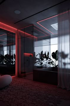 an empty room with some plants in the corner and red lights shining on the walls