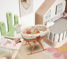 a baby's room is decorated in pastel colors with cactus and cacti