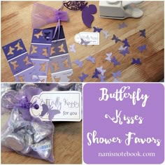 purple and silver butterflies are on the table with tags that say, butterfly kisses shower favors