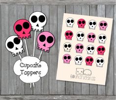 some stickers with skulls on them next to a sheet of paper that says cupcake toppers