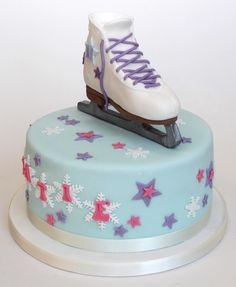 a cake decorated with ice skates and stars