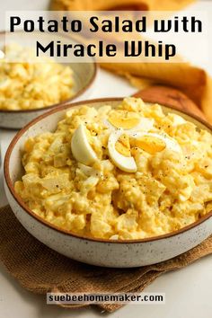 two bowls filled with macaroni and cheese on top of a table