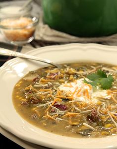 a white bowl filled with soup on top of a table