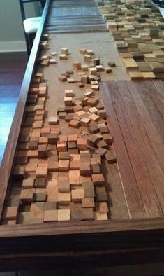 a wooden table with many pieces of wood on it