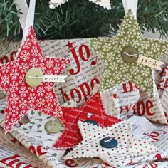 christmas tree ornaments are stacked on top of each other and decorated with red, white and green fabric