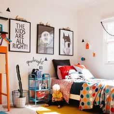 a child's bedroom with posters on the wall