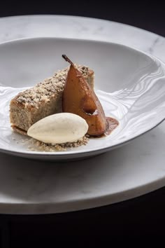 a white plate topped with food on top of a table