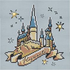 an image of a cross stitched castle with stars in the sky and on it's side