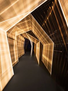 an image of light painting in the middle of a tunnel with lights coming from it