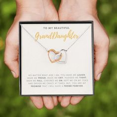 FREE WORLDWIDE SHIPPING ON ALL ORDERS! Granddaughter is a precious jewel that we cherish in heart forever, celebrate her every special occasion, and remind her of that your loves forever. Two hearts embellished with Cubic Zirconia stones, interlocked together as a symbol of never-ending love. Comes with luxury gift box. #birthday #graduation #wedding #highschool #christmas #sweet16 Anniversary Heart Necklace For Mother's Day, Heart Charm Jewelry For Mother's Day, Heart Necklace With Hallmark For Anniversary And Mother's Day, Valentine's Day Engraved Open Heart Charm Necklace, Elegant Personalized Heart Necklace For Valentine's Day, Elegant Heart Necklace For Valentine's Day Personalized Gift, Heart Necklace For Anniversary, Mother's Day With Hallmark, Nickel-free Heart Pendant Charm Necklace For Personalized Gift, Necklace For Granddaughter Under $25.00