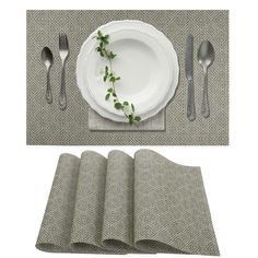 the place setting is ready to be served with silverware, napkins and forks