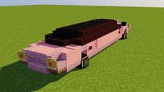 a large pink truck is parked in the grass