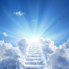 the sky is filled with clouds and there are many steps going up to the top