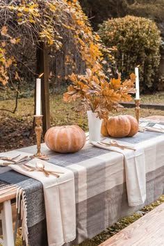 two pumpkins sitting on top of a table