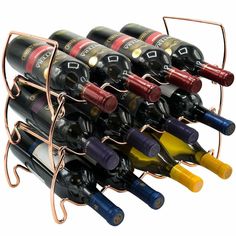 a bunch of wine bottles that are in a metal holder on a white background,