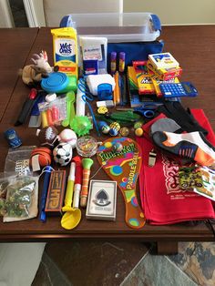 the table is full of toys and other items