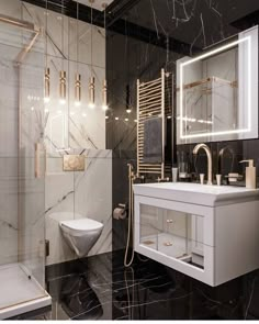 a bathroom with black marble and gold accents