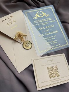 wedding stationery with gold and blue details on the front, back and side of the card