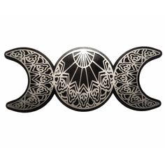 two black and white crescents with intricate designs on them