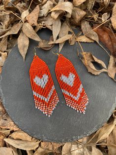 Love burnt orange beaded fringe earrings, seed bead earrings dangle boho earrings native beaded earrings chandelier earrings colorful beaded ♥𝑇ℎ𝑒 𝑝𝑎𝑡𝑡𝑒𝑟𝑛 𝑜𝑓 𝑡ℎ𝑖𝑠 𝑒𝑎𝑟𝑟𝑖𝑛𝑔 𝑖𝑠 𝑐𝑟𝑒𝑎𝑡𝑒𝑑 𝑏𝑦 𝐾𝑎𝑍𝑒𝐵𝑒𝑎𝑑𝐽𝑒𝑤𝑒𝑙𝑟𝑦 ♥𝑀𝑎𝑑𝑒 𝑢𝑠𝑖𝑛𝑔 𝑓𝑟𝑒𝑒ℎ𝑎𝑛𝑑 𝑏𝑒𝑎𝑑𝑖𝑛𝑔 𝑤𝑜𝑣𝑒𝑛 𝑡𝑒𝑐ℎ𝑛𝑖𝑞𝑢𝑒𝑠 𝑤𝑖𝑡ℎ 𝑠𝑡𝑟𝑜𝑛𝑔 𝑠𝑦𝑛𝑡ℎ𝑒𝑡𝑖𝑐 𝑡ℎ𝑟𝑒𝑎𝑑. ♥𝑇ℎ𝑒 𝑠𝑖𝑧𝑒 𝑜𝑓 𝑡ℎ𝑒 𝑠𝑒𝑒𝑑 𝑏𝑒𝑎𝑑𝑠 𝑢𝑠𝑒𝑑 𝑖𝑠 2 𝑚𝑖𝑙𝑙𝑖𝑚𝑒𝑡𝑒𝑟𝑠 𝑎𝑛𝑑 𝑏𝑒𝑎𝑑𝑠 𝑎𝑟𝑒 ℎ𝑖𝑔ℎ 𝑞𝑢𝑎𝑙𝑖𝑓𝑖𝑒𝑑. ♥𝐴𝑙𝑙 𝑡ℎ𝑒 ℎ𝑜𝑜𝑘𝑠 𝑢𝑠𝑒𝑑 𝑖𝑛 𝑜𝑢𝑟 𝑗𝑒𝑤𝑒𝑙𝑟𝑦 𝑎𝑟𝑒 24 𝑘 𝑔𝑜𝑙𝑑 𝑝𝑙𝑎𝑡𝑒𝑑 𝑎𝑛𝑑 ℎ𝑦𝑝𝑜𝑎𝑙𝑙𝑒𝑟𝑔𝑒𝑛𝑖𝑐. ♥𝑇ℎ𝑒𝑠𝑒 𝑎𝑟𝑒 𝑣𝑒𝑟𝑦 𝑙𝑖𝑔ℎ𝑡 𝑒𝑎𝑟𝑟𝑖𝑛𝑔𝑠 𝑡ℎ𝑎𝑡 𝑦𝑜𝑢 𝑐𝑎𝑛 𝑤𝑒𝑎𝑟 𝑎𝑙𝑙 𝑑𝑎𝑦 𝑤𝑖𝑡ℎ𝑜𝑢𝑡 ℎ𝑢𝑟𝑡𝑖𝑛𝑔 𝑦𝑜𝑢𝑟 𝑒𝑎𝑟! The o Beaded Earrings Orange, Orange Fringe Earrings, Dangle Beaded Earrings With Fringe For Crafting, Bohemian Beaded Heart-shaped Jewelry, Southwestern Beaded Fringe Earrings As Gift, Southwestern Fringe Beaded Earrings As Gift, Southwestern Beaded Fringe Earrings For Gift, Southwestern Fringe Beaded Earrings For Gift, Southwestern Style Beaded Fringe Earrings For Gift