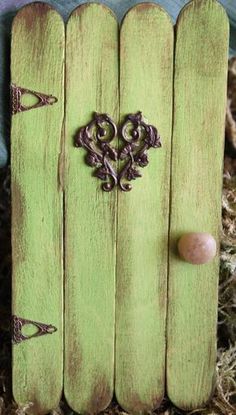 a close up of a wooden fence with an iron heart on it