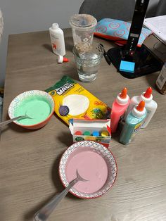 the table is cluttered with dishes and condiments