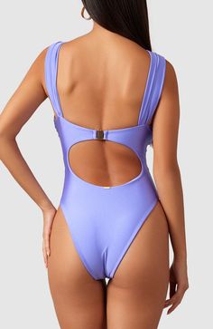 Thoughtfully placed gathers and a center knot create beautiful ruching along the top and straps of this elegant one piece swimsuit. Whether wearing on a yacht or by the pool, this stunner will have you looking and feeling like money. Thick double-lined fabric Gold colored clasp - tarnish and rust resistant High cut at legs Cheeky bottoms Periwinkle Swimsuit, Purple One-piece Swimsuit For Summer Poolside, One-piece Swimwear With Back Closure For Pool, Fitted Purple One-piece Beachwear, Affordable Purple One-piece Swimwear, On A Yacht, Beach Wear Outfits, A Yacht, Beach Wears