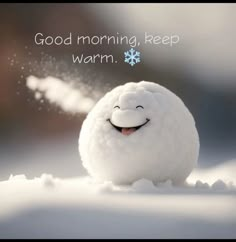 a white snowball with a smile on it's face and the words good morning, keep warm