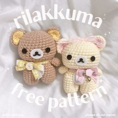 two small crocheted teddy bears sitting next to each other on a white sheet