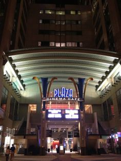 the entrance to plaza cinema club at night