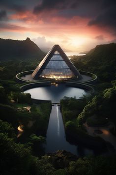 an aerial view of a pyramid shaped building in the middle of a lake at sunset