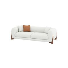 a white couch with two brown pillows on the back and one tan pillow on top