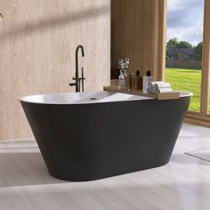 a bath tub sitting on top of a white floor