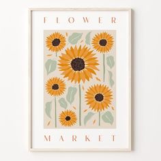 a yellow flower market poster hanging on a wall