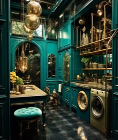 a room with green walls and lots of gold decorations on the ceiling, along with a washer and dryer