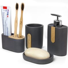 bathroom accessories including soap dispenser, toothbrush and lotion in grey containers