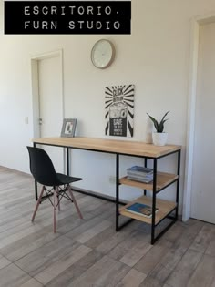 there is a desk and chair in the corner of this room with a clock on the wall