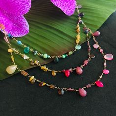 You will fall in love with this rainbow multi gemstone triple strand necklace in 14K gold fill. It has Carnelian, Ruby, rose Quartz, Citrine, fire Opal, green Onyx, Emerald, Sapphire, Lapis Lazuli, Amethyst, beach glass beads and more! Your handmade statement necklace is a wearable work of art with a juicy colorful array of  gemstones in an Ombré pattern. There is so much love and attention to detail I put into each piece. I lay out carefully chosen shades and shapes of semi precious stones maki Double Strand Jewelry With Gemstone Accents For Gift, Multicolor Double Strand Jewelry For Gift, Multicolor Double Strand Jewelry With Natural Stones, Multicolor Double Strand Jewelry Gift, Rainbow Multi-strand Jewelry For Gifts, Bohemian Multicolor Briolette Jewelry, Rainbow Multi-strand Necklace Gift, Rainbow Multi-strand Necklace For Gift, Rainbow Multi-strand Necklace As Gift