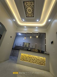 the interior of a building with lights and decorations on the ceiling, along with a counter