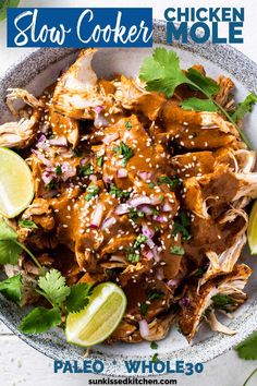 the slow cooker meal is ready to be eaten with limes and cilantro