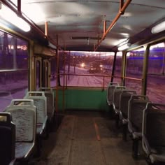 the inside of a bus with lots of seats and windows on it's sides